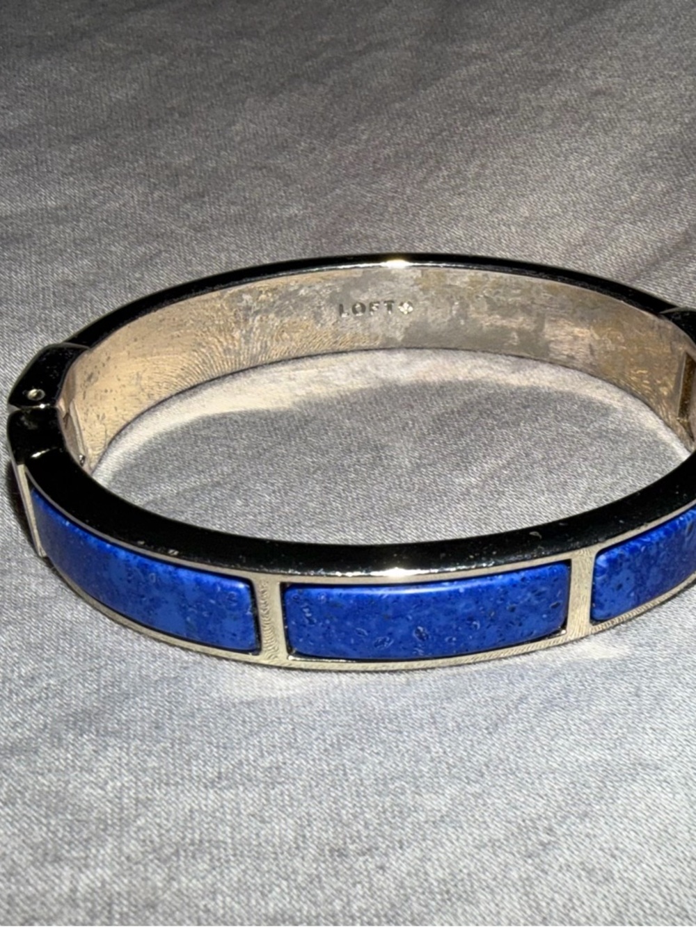 Silver-Toned Hinged Oval Bangle Bracelet with Lapis stones
